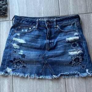 American Eagle Outfitters Distressed Denim Skirt with Floral Embroidery